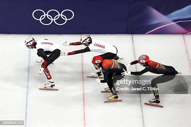 William Dandjinou and Felix Roussel of Team Canada compete against Xiaojun Lin and Long Sun of Team People's Republic of China in the quarterfinals...