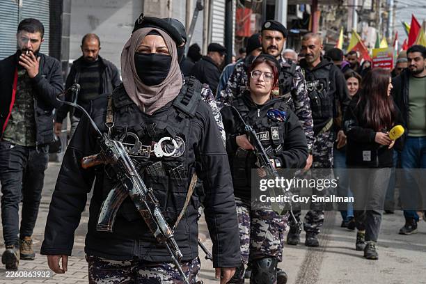 Security for the protest is provided by the local Asayish during a demonstration for Kurdish rights on February 10, 2026 in Qamishli, Syria. The...