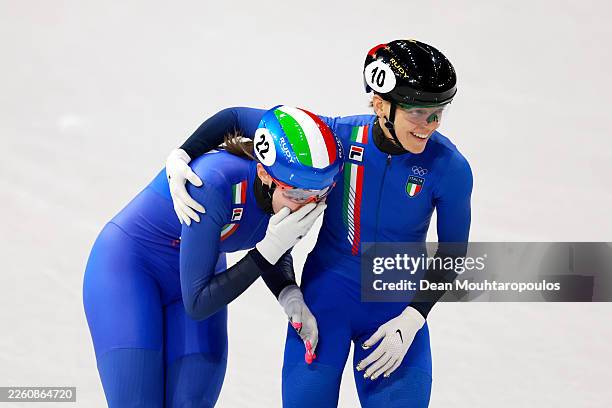 Chiara Betti and Arianna Fontana of Team Italy react after the semi-finals of the Short Track Speed Skating Mixed Team Relay on day four of the...