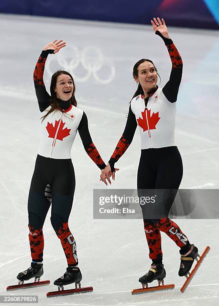 Kim Boutin and Courtney Sarault of Team Canada celebrate after winning Silver in the Short Track Speed Skating Mixed Team Relay on day four of the...