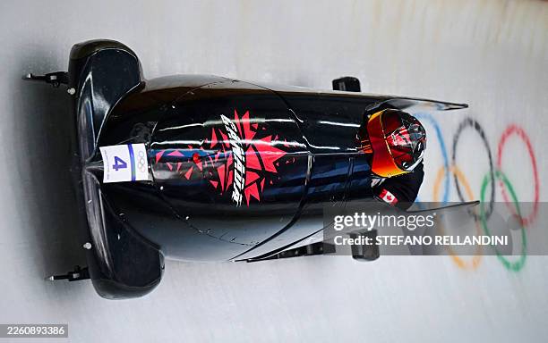 Canada's Jay Dearborn pilots in the bobsleigh men's 2-man training Heat 4 at Cortina Sliding Centre during the Milano Cortina 2026 Winter Olympic...