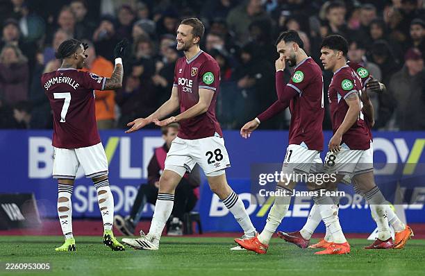 Tomas Soucek of West Ham United celebrates scoring his team's first goal with teammate Crysencio Summerville during the Premier League match between...