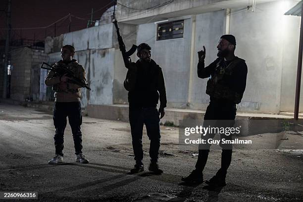 Members of the Kurdish security volunteers patrol the Qadourbek neighbourhood at night to protect local people against potential security threats...