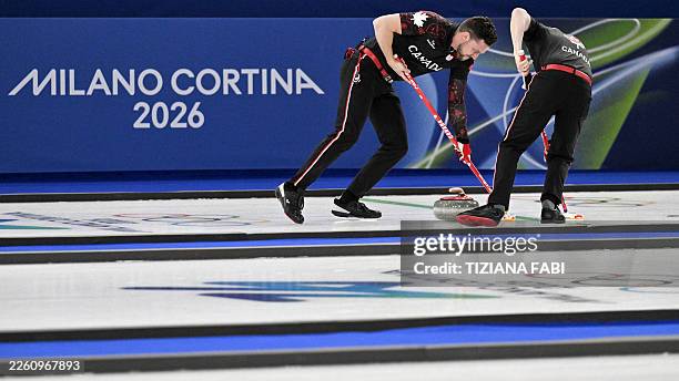 Canada's Brett Gallant and team mate sweep the ice during the curling men's round robin between Canada and Sweden during the Milano Cortina 2026...