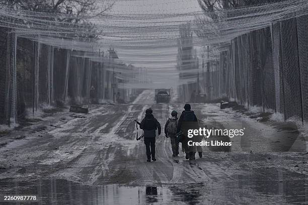 Protective nets above a road between Druzhkivka and Kostyantynivka as mobile fire groups patrol the area to intercept and shoot down Russian FPV...