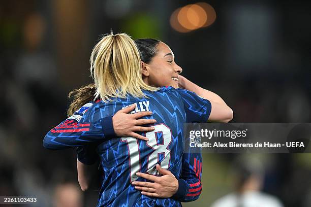 Olivia Smith of Arsenal celebrates scoring her team's second goal with teammate Chloe Kelly during the UEFA Women's Champions League 2025/26 KO...