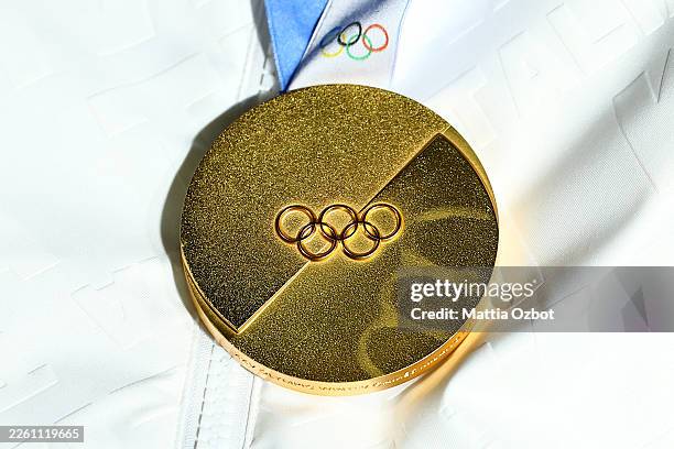 Detailed view of a gold medal during the medal ceremony for the Luge Women's Doubles on day five of the Milano Cortina 2026 Winter Olympic games at...