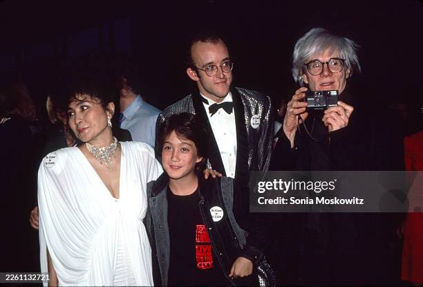 Yoko Ono, Sean Lennon, Keith Haring and Andy Warhol attend the American Foundation for AIDS Research Benefit at the Jacob Javits Convention Center on...