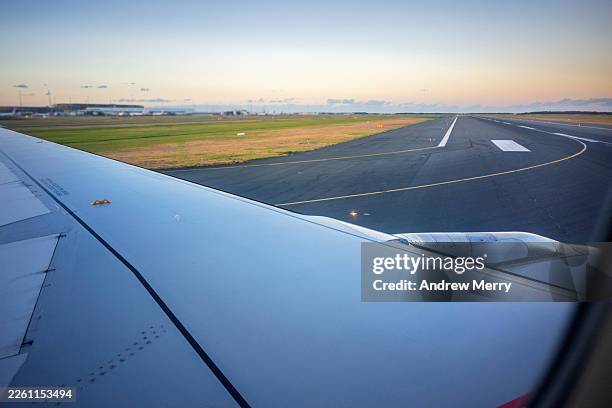 airplane taxiing for takeoff passenger window view - queensland stock pictures, royalty-free photos & images