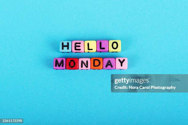 hello monday words beads alphabets on blue background - lunedì foto e immagini stock