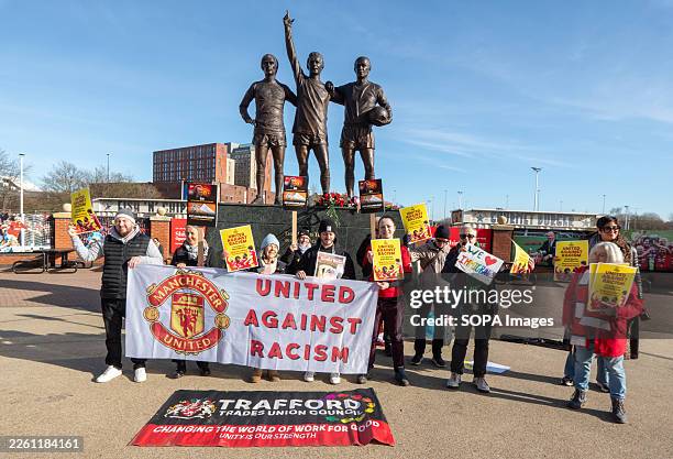 Sample Rally Placards Protesters hold a banner and placards during the rally in front of ...