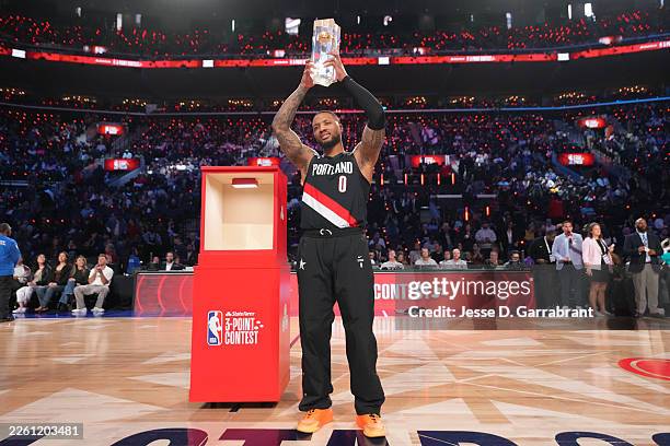 Damian Lillard of the Portland Trail Blazers raises the State Farm 3-Point Contest trophy after the State Farm 3-Point Contest as part of the 2026...