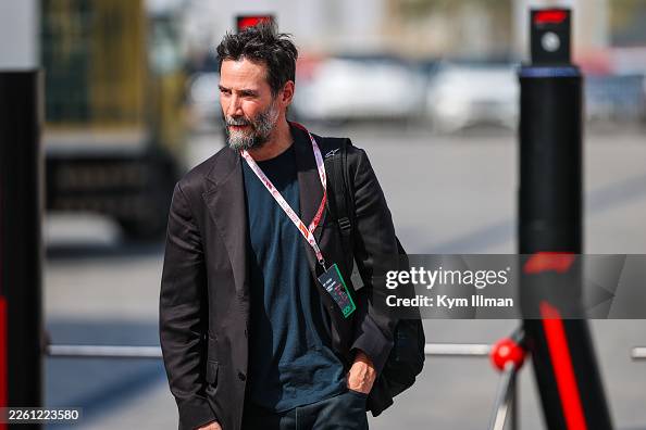 Paddock Actor Actor Keanu Reeves walks in the paddock during day two of F1 Testing ...