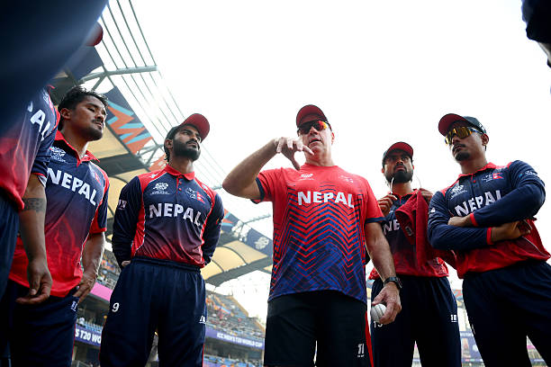 Nepal Head Coach Stuart Law speaks to his players during the ICC Men's T20 World Cup India & Sri Lanka 2026 match between Nepal and Italy at Wankhede...