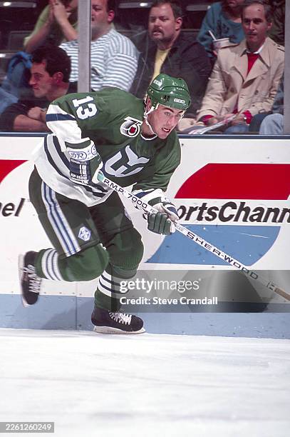 Hartford Whalers forward Geoff Sanderson is charging up ice with the puck during the game against the NJ Devils at the Meadowlands Arena on November...