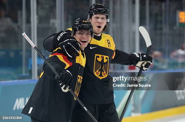 Tim Stutzle of Team Germany celebrates after scoring a goal with Moritz Seider in the second period during the Men's Preliminary Group C match...