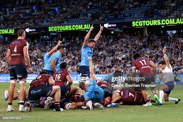 Isaac Aedo Kailea of the Waratahs scores a try during the round one Super Rugby match between NSW Waratahs and Queensland Reds at Allianz Stadium, on...