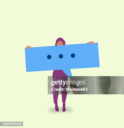 Person holding large speech bubble symbolizing online messaging and communication Person holding large speech bubble symbolizing online messaging and communication