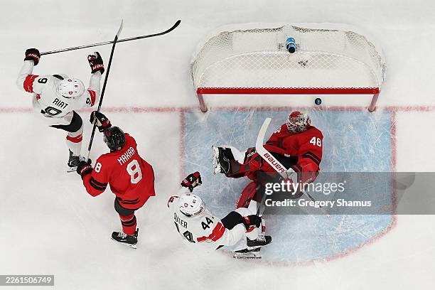 Pius Suter of Team Switzerland scores a goal past Logan Thompson of Team Canada in the first period during the Men's Preliminary Group A match...