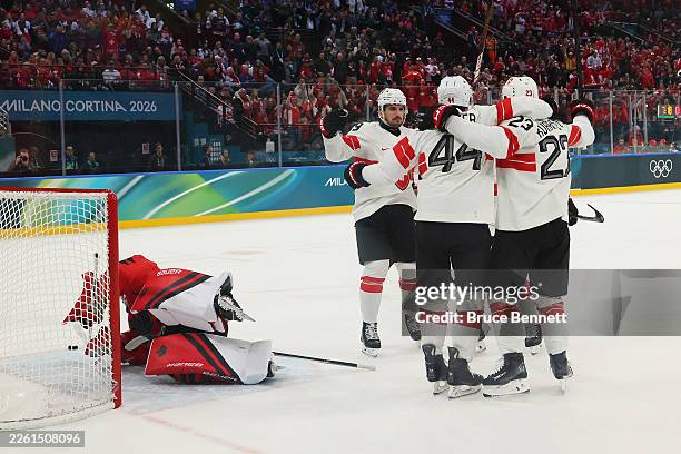 Pius Suter of Team Switzerland celebrates with teammates after scoring a goal in the first period during the Men's Preliminary Group A match between...