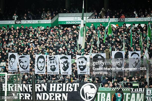 Supporters of Bremen remember the victims of the racist attack in Hanau six years ago the Bundesliga match between SV Werder Bremen and FC Bayern...