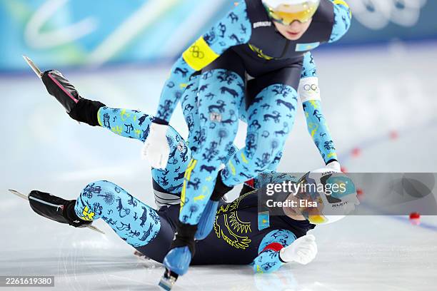 Arina Ilyachshenko of Team Kazakhstan crashes during the quarterfinals of the Speed Skating Women's Team Pursuit on day eight of the Milano Cortina...