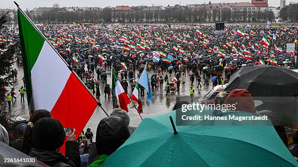 People protesting for human rights in Iran demonstrate at Theresienwiese during the 62nd Munich Security Conference on February 14, 2026 in Munich,...