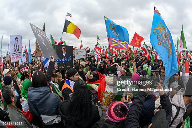 People protesting for human rights in Iran demonstrate at Theresienwiese during the 62nd Munich Security Conference on February 14, 2026 in Munich,...