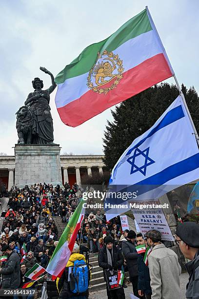 People protesting for human rights in Iran demonstrate at Theresienwiese during the 62nd Munich Security Conference on February 14, 2026 in Munich,...