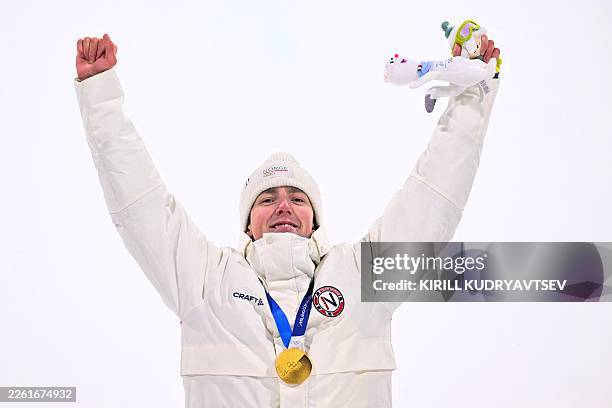 Gold medallist Norway's Tormod Frostad poses on the podium after the freestyle skiing men's freeski big air final during the Milano Cortina 2026...