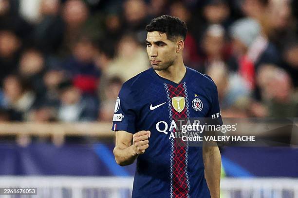 Paris Saint-Germain's Moroccan defender Achraf Hakimi celebrates scoring his team's second goalduring the UEFA Champions League knockout round...