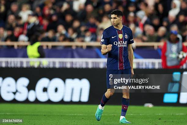 Paris Saint-Germain's Moroccan defender Achraf Hakimi celebrates scoring his team's second goalduring the UEFA Champions League knockout round...