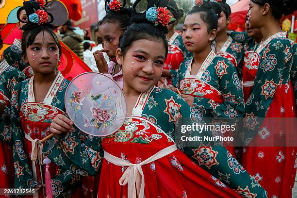 Nepalese artists pose for a photograph during the Lantern Festival at Patan Durbar Square in Lalitpur, Nepal, on February 17, 2026. The Lantern...