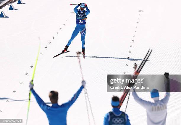 Federico Pellegrino of Team Italy approaches the finish line to win bronze in the Men's 4 x 7.5km Relay on day nine of the Milano Cortina 2026 Winter...