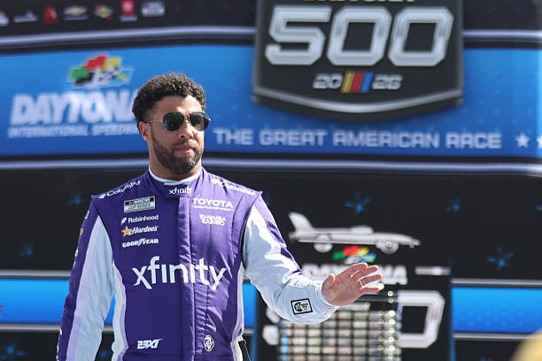 Bubba Wallace waves to the crowd prior to the running of the 68th NASCAR Cup Series Daytona 500 on February 15, 2026 at Daytona International...