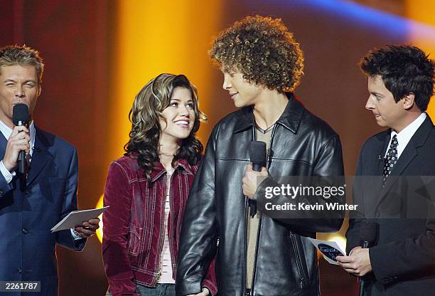 Hosts Ryan Seacrest and Brian Dunkleman with Kelly Clarkson and Justin Guarini before the announcement of the winner of American Idol at the Kodak...