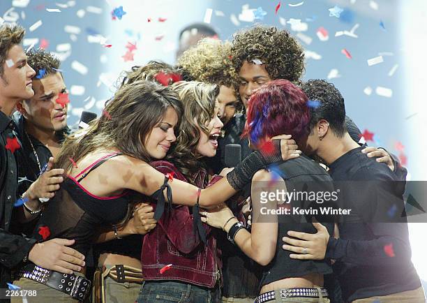 American Idol winner Kelly Clarkson embraces Idol contestants at the Kodak Theatre in Hollywood, Ca., Sept. 4, 2002.