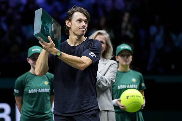 Alex de Minaur of Australia holds the winners trophy after defeating Felix Auger-Aliassime of Canada in the ABN AMRO Open Mens Singles Final at...