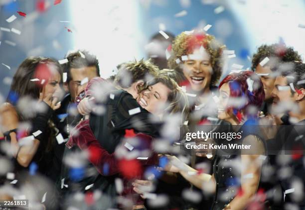 American Idol winner Kelly Clarkson embraces Idol contestants at the Kodak Theatre in Hollywood, Ca., Sept. 4, 2002.