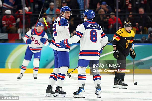 Tage Thompson of Team United States celebrates with Zach Werenski after scoring a goal in the third period during the Men's Preliminary Group C match...