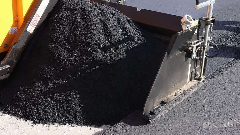 https://media.gettyimages.com/id/2261833012/video/road-construction-workers-laying-asphalt-on-new-street-in-residential-area.jpg?b=1&s=640x640&k=20&c=gUkKFtbWr3HeSsS3ugGzwScLmn2XOtwLqRmiEH46X3Y=