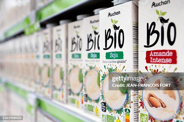 Close-up of boxes of organic almond and soy milk from the Auchan brand in the organic section of an Auchan hypermarket in Poitiers, in the Vienne...