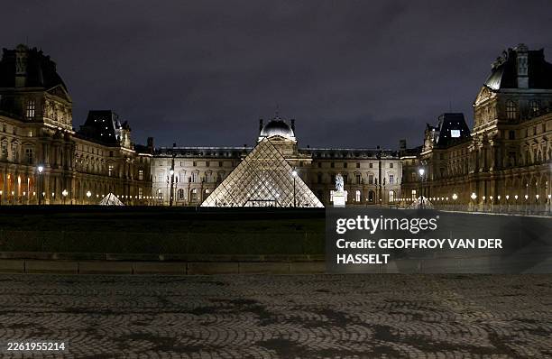 This photograph shows the Pyramide du Louvre, designed by Chinese-US architect Ieoh Ming Pei, with the Louvre Museum in the background in Paris on...