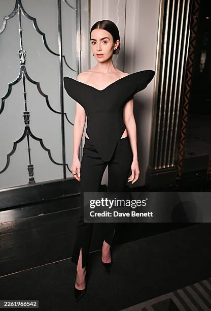 Lily Collins attends the Harris Reed Autumn / Winter 2026 show during London Fashion Week at Claridge's Hotel on February 19, 2026 in London, England.