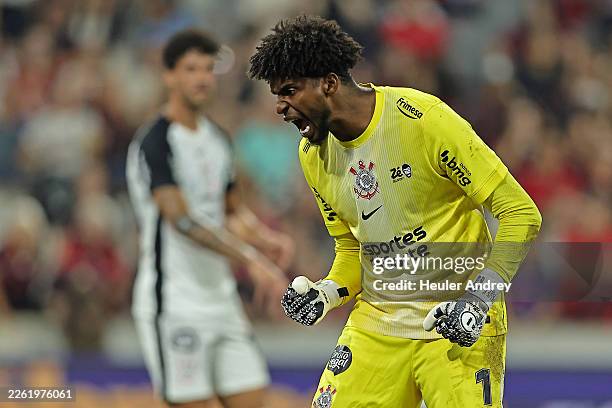 Goalkeeper Hugo Souza of Corinthians celebrates after saving a penalty kick by Julimar of Athletico Paranaense during the match between Athletico...