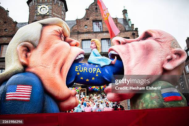 Carnival float mocks American President Donald Trump and Russian President Vladimir Putin during the annual Rose Monday parade on February 16, 2026...