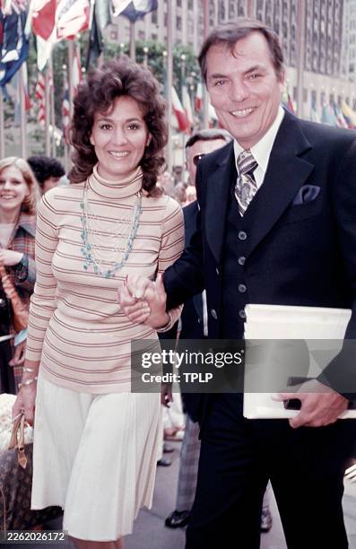 American game show host Peter Marshall poses for a portrait with an unidentified woman prior to hosting the 1st Daytime Emmy Awards at Rockefeller...