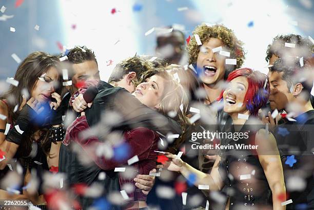 American Idol winner Kelly Clarkson embraces Idol contestants at the Kodak Theatre in Hollywood, Ca., Sept. 4, 2002.