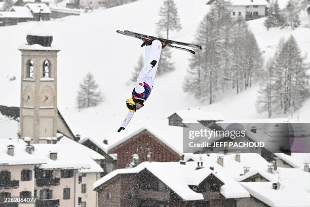 China's Qi Guangpu competes in the freestyle skiing men's aerials qualification 1 during the Milano Cortina 2026 Winter Olympic Games at Livigno...