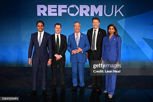 Reform UK Leader Nigel Farage stands with his shadow cabinet Zia Yusuf, Shadow Home Secretary , Robert Jenrick, Shadow Chancellor of the Exchequer ,...